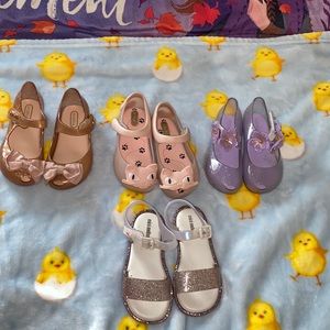 4 pairs of mini melissa shoes